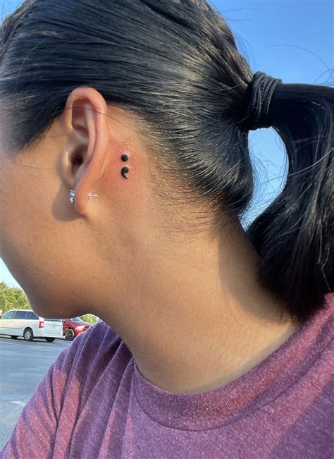 semicolon behind ear tattoo|Iba pa.